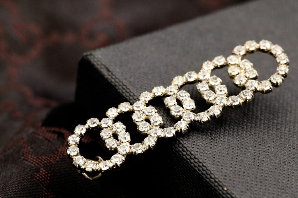 A close up of a brooch on a piece of cloth