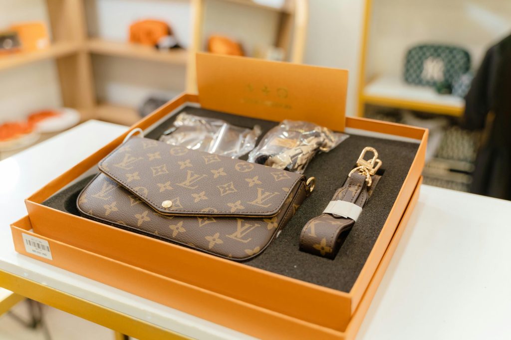 High-end Louis Vuitton monogram bag set displayed in a luxury boutique.