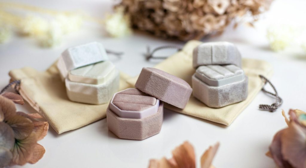 Chic and elegant jewelry boxes displayed on a soft, neutral-toned setting, perfect for showcasing style and design.