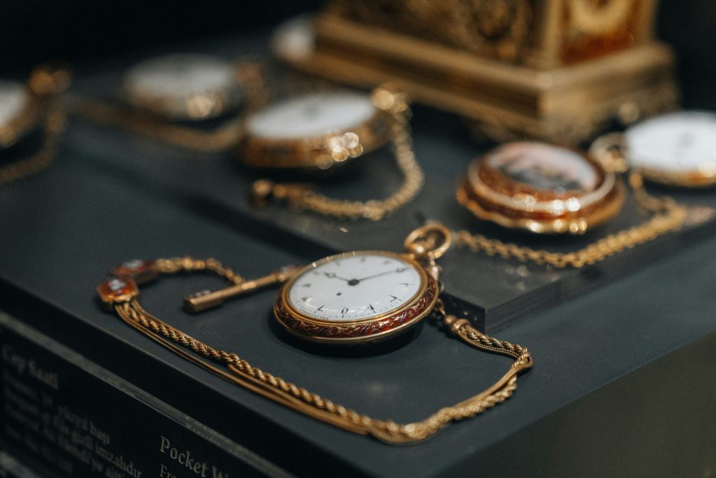 a collection of antique pocket watches on display